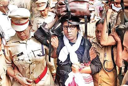 Police taking a middle-aged woman devotee  back to Pampa after protest by Sabarimala pilgrims  |  Shaji Vettipu ram