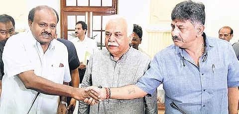 Chief Minister H D Kumaraswamy greets Revenue Minister R V Deshpande and Water Resources Minister D K Shivakumar | Nagaraja Gadekal