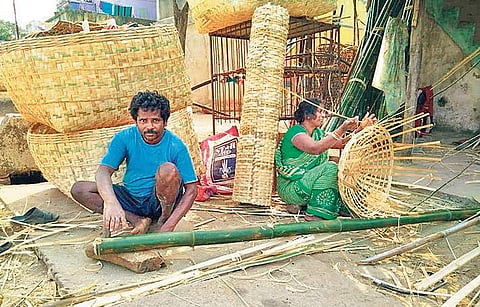 Gurumurthy and his wife Sridevi making bamboo items I Express