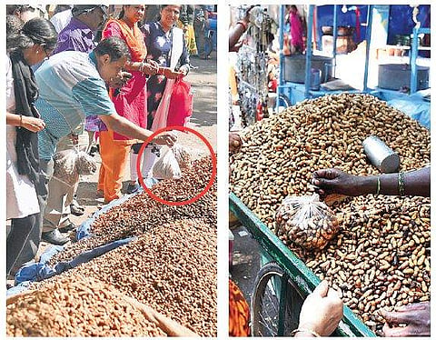 Customers and vendors use plastic bags to pack groundnuts  Nagaraja Gadekal