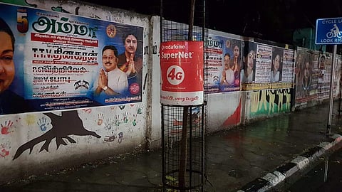 A political poster glued to  on a wall in Chennai's MRC Nagar (Photo | Special Arrangement)