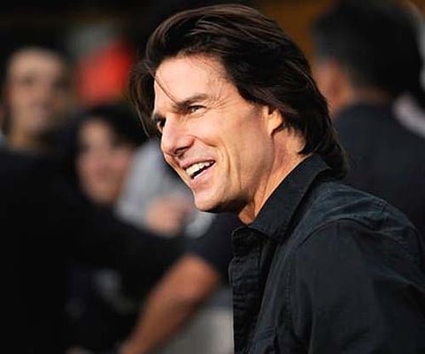 Actor Tom Cruise smiles for photographers in Los Angeles. (AP)