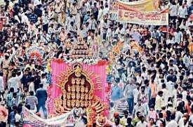  Scores of devotees made a beeline on the Canal Road in the city, here on Thursday to witness the  annual rathotsavam, celestial chariot procession, of Sri Malleswara Swamy and his consort