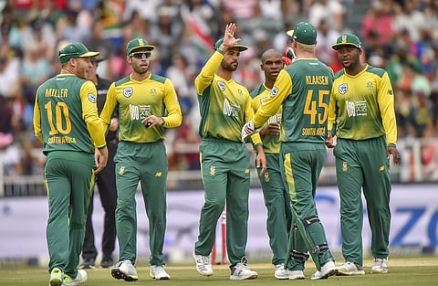 South African batsman JP Duminy, center, congratulates Heinrich Klaasen on catching out Indian batsman Rohit Sharma during the 1st T20I cricket match in Johannesburg, South Africa, Saturday Feb. 18, 2018. | AP