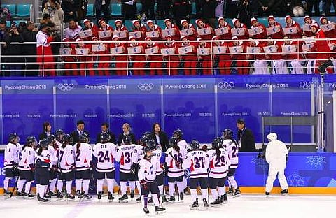 North Korean cheerleaders hold the Unified Korea flag as the team play during Pyeongchang  Games (File | AFP)
