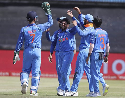 Indian team celebrating the fall of a South African wicket during the first ODI in Durban's Kingsmead Stadium. | AP
