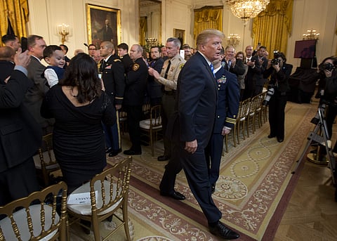President Donald Trump leaves the East Room of the White House at the end of a public safety Medal of Valor awards ceremony, Tuesday, Feb. 20, 2018, in Washington. | AP
