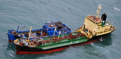 This Feb. 16, 2018 photo released by Japan's Ministry of Defense, shows what it says North Korean-flagged tanker Yu Jong 2, bottom, and Min Ning De You 078 lying alongside in the East China Sea. | AP