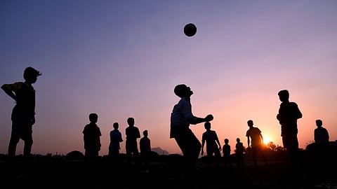 Young boys seen playing football at Kurichi Kalam in Coimbatore. (EPS | A. Raja Chidambaram)