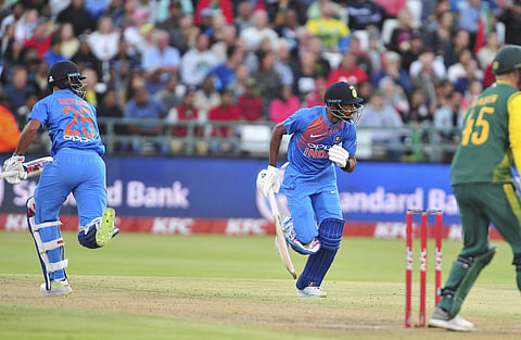 India's Suresh Raina, right, takes a run. | AP