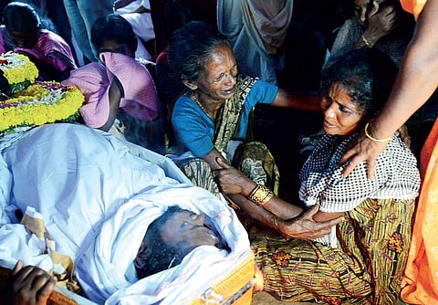 Madhu’s mother and family members beside the body when it was brought to Attappadi on Saturday | Express