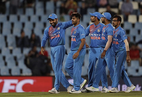 India's Rohit Sharma, left, congratulates India's bowler Jaydev Unadkat, second from left, after dismissing South Africa's batsman Reeza Hendricks‚ for 26 runs during the second T20 cricket match between South Africa and India at Centurion Park in Pretori