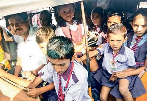 Students jostle for space inside the  jam-packed autos; school bags dangle  at the back of the vehicle | Express