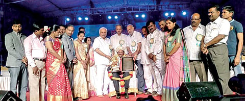 Poet K S Nissar Ahmed being honoured with the Pampa Award at Kadambotsava in Banavasi on Friday