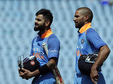 India's captain Virat Kohli, left, with teammate Shikhar Dhawan leave the field after winning their second One Day International cricket against South Africa and India at Centurion Park in Pretoria. | AP