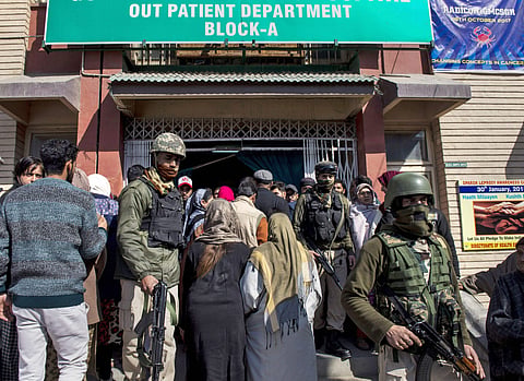 Security personnel during a search operation after an attack on SMHS hospital in Srinagar. (PTI)
