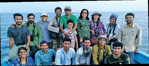 M Shivshankar with his team during a sea bird watching session off Mangaluru coast