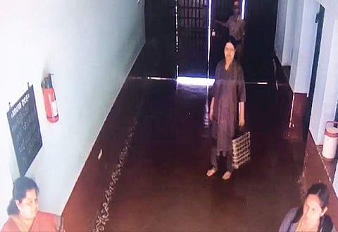 A video grab of AIADMK leader V K Sasikala(carrying a handbag) and her aide Ilavarasi (extreme left) inside the central prison (File photo)