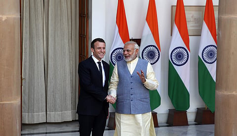 Prime Minister Narendra Modi shakes hand with Frances President Emmanuel Macron in New Delhi on Saturday (Express Photo | Shekhar Yadav)