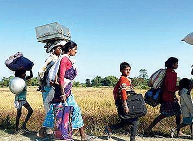 Some members of the Konda Reddy tribe seen migrating to safer places, in  Bhadrachalam district on Monday | Express photo