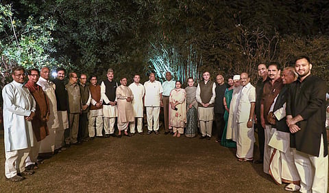 UPA Chairperson Sonia Gandhi poses for a photograph with opposition party leaders before the dinner party at her residence at 10 Janpath in New Delhi. | PTI