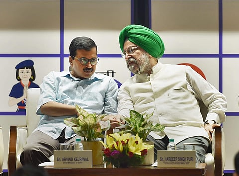 Union Minister for Urban Development Hardeep Singh Puri and Delhi Chief Minister Arvind Kejriwal during the inauguration of Delhi Metro Pink Line at DMRC Bhawan in New Delhi on Wednesday. | PTI