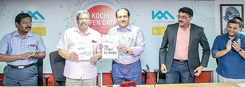 KMRL MD  A P M Mohammed Hanish releasing KMRL newsletter by handing over a copy to WRI India CEO O P Agarwal in Kochi on Friday. Smart City Kochi CEO Manoj Nair and WRI director Madhav Pai look on