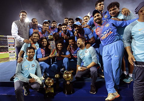 Dinesh Karthik did a Javed Miandad with a last-ball six as India pulled off an incredible chase beating Bangladesh by four wickets in the Nidahas T20 Tri-series final on Sunday.  IN PIC:  The victorious Indian side with the Nidahas Trophy. (Photo | AP)