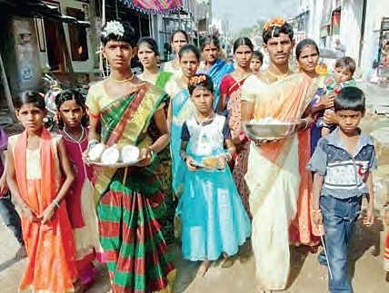 Villagers of Santhekudluru in Kurnool district celebrate Holi festival on Thursday with gaiety and fervour | Express