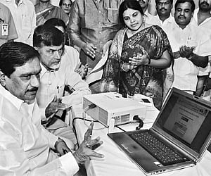 TDP president N Chandrababu Naidu and party election committee chairman KE Krishna Murthy (left)