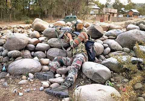 An Army personnel takes position during an encounter in J&K. (FIle | PTI)