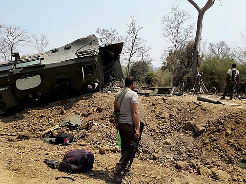 Security personnel inspect the site of an IED blast where nine CRPF personnel were killed and two more were injured after Maoists ambushed them in Kistaram area of Chhattisgarh's Sukma district. | PTI