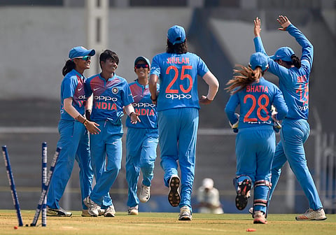 Indian cricket team members celebrate the dismissal of Australia's Ashleigh Gardner during the Women's T20I Tri-series at Brabourne stadium in Mumbai. | PTI
