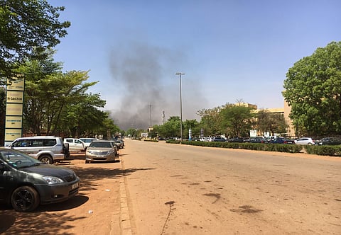 Smoke can be seen rising in the distance in central Ouagadougou, Burkina Faso. | AP