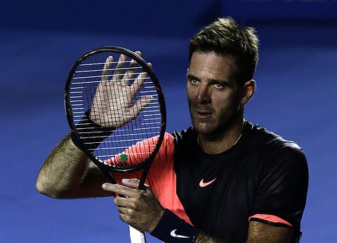 Argentina's Juan Martin Del Potro claps his hand against his racket as he salutes fans after defeating Germany's Alexander Zverev in their semifinal match at the Mexican Tennis Open in Acapulco. | AP