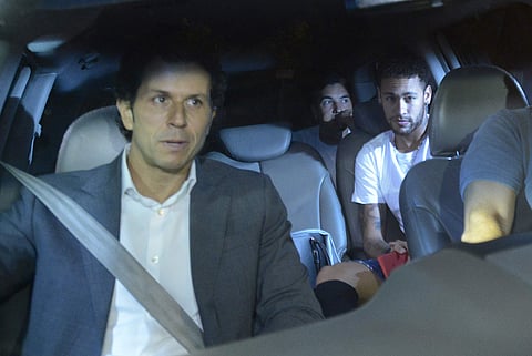 Brazil soccer star Neymar, right, and his doctor Rodrigo Lasmar, left, arrive to the Mater Dei Hospital, in Belo Horizonte, Brazil, Friday, March 2, 2018. | AP