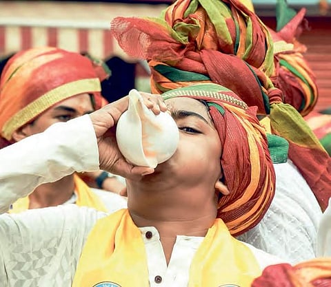 A Jain youth blows a conch during the ‘aheemsa march’ on the occassion of Mahaveer Jayanti in  Vijayawada on Thursday | Express