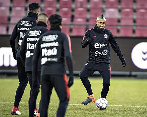 Chile's Arturo Vidal controls the ball, during a training session at the Aalborg Portland Arena, in Aalborg, Denmark, Monday, March 26, 2018. | AP
