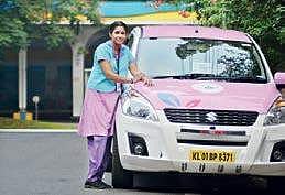 A She Taxi driver near her cab  Manu R Mavelil