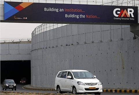 Vehicles cross through an underpass constructed by GMR Infrastructure that connects to the airport in New Delhi (File | REUTERS)