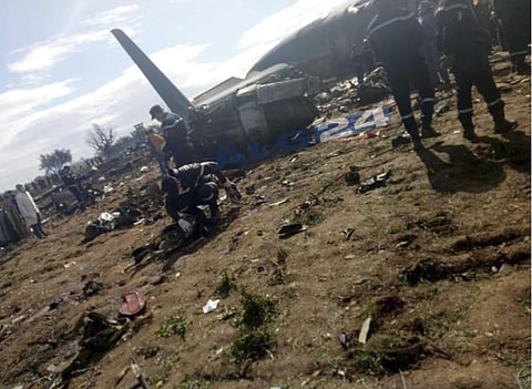 This image dated Wednesday, April 11, 2018, and posted by Algerian news agency ALG24, shows firefighters and soldiers at the scene of a fatal military plane crash near Boufarik military base near the Algerian capital, Algiers. (Photo: AP)