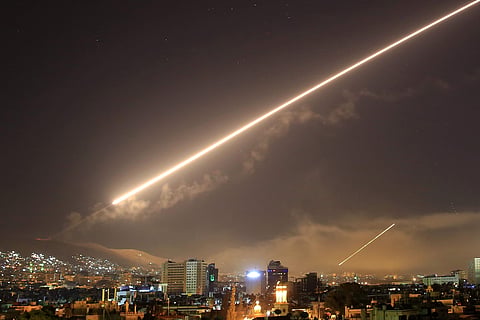 Damascus skies erupt with surface to air missile fire as the U.S. launches an attack on Syria targeting different parts of the Syrian capital Damascus. | AP