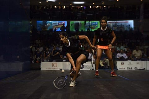 India's Joshana Chinnappa (L) plays a shot against her compatriot Dipika Pallikal during the women's final match at the 19th Asian Squash Championship in Chennai on April 30, 2017.  ARUN SANKAR / AFP