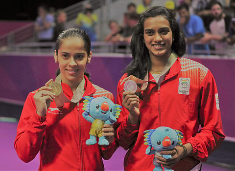Gold medalists Saina Nehwal, left, and silver medalist PV Sindhu during the Commonwealth Games on April 15, 2018. (AP Photo)