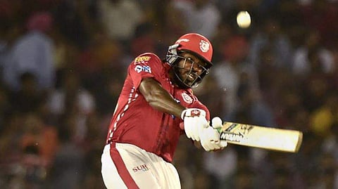 Kings XI Punjab Batsman Chris Gayle plays a shot during the IPL T20 match against Chennai Super Kings at the Punjab Cricket Association Stadium in Mohali. (PTI)