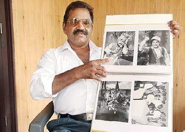 G Ravisankar, a former AVM studio staffer, with his MGR photo collection  T P Sooraj