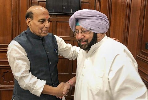 Union Home Minister Rajnath Singh and Punjab Chief Minister Captain Amarinder Singh during a meeting on the issue of a comprehensive strategy to tackle the re-emergence of extremism in Punjab in New Delhi on Thursday. | PTI