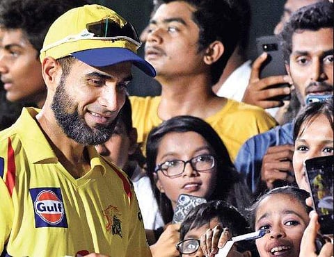 CSK’s Imran Tahir signs autographs for fans at Chepauk on Sunday. (EPS | Ashwin Prasath)