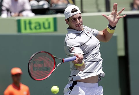 Alexander Zverev returns to John Isner during the final at the Miami Open. | AP
