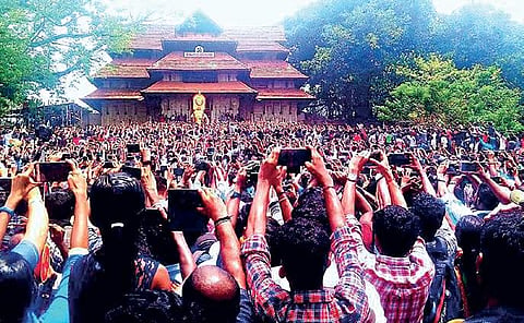 Pooram lovers clicking snaps as the southern entrance of the Vadakkunnathan temple is opened on Tuesday